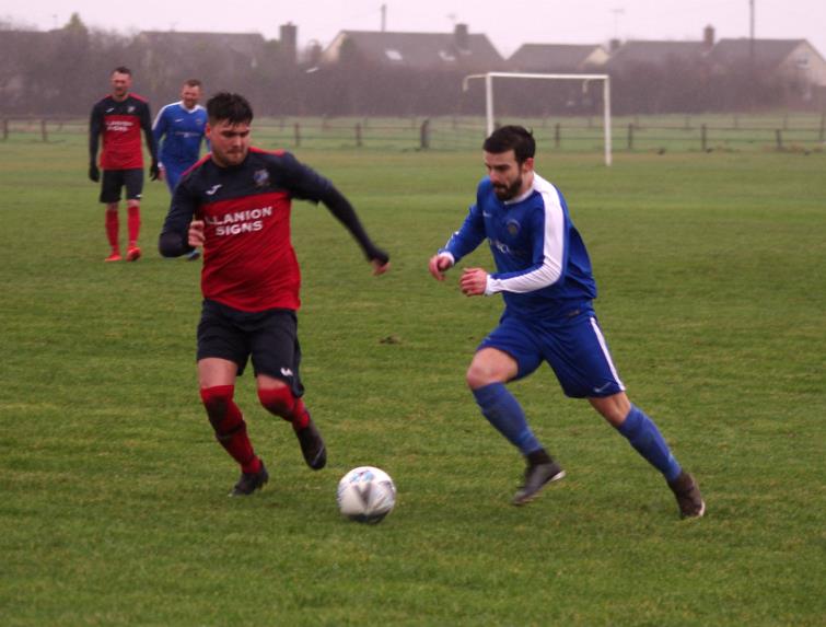 Action from a rain swept Racecourse as Merlins Bridge lost heavily against high-flying Monkton Swifts